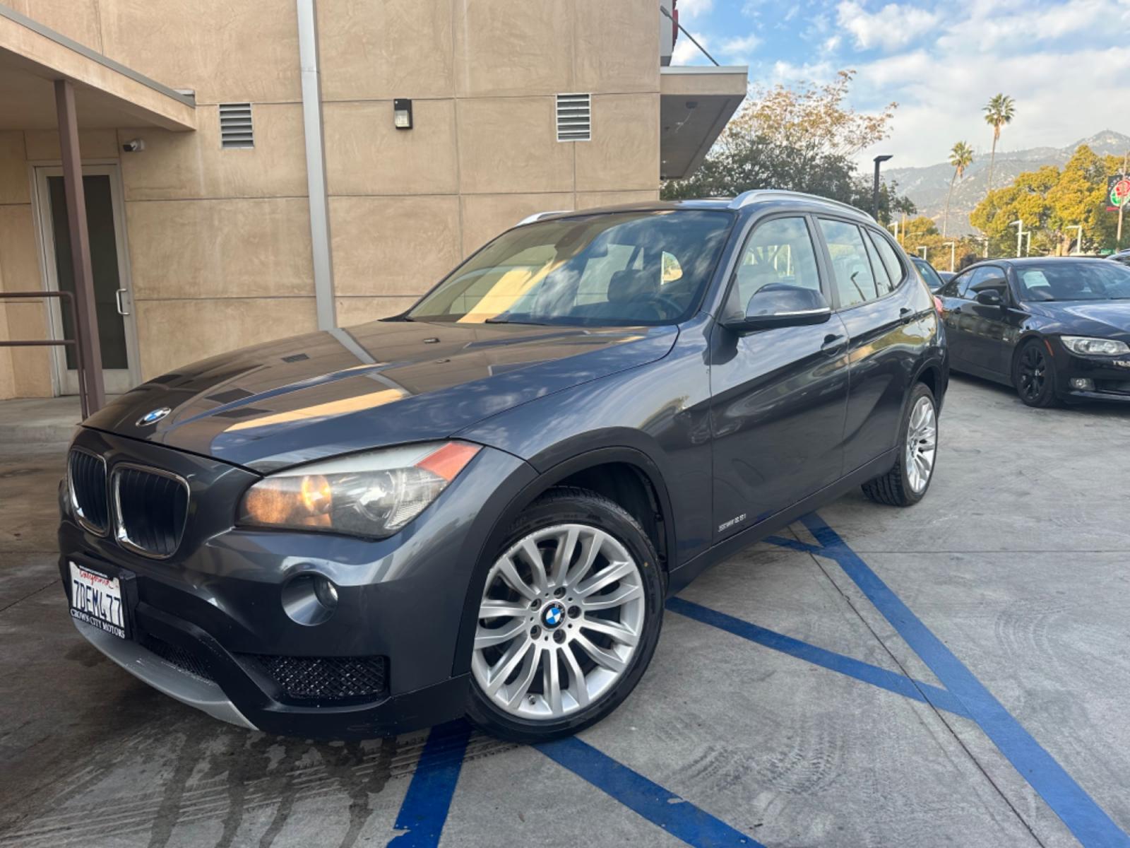 2014 Gray /black BMW X1 leather (WBAVM1C58EV) with an 4 CYLINDER engine, Automatic transmission, located at 30 S. Berkeley Avenue, Pasadena, CA, 91107, (626) 248-7567, 34.145447, -118.109398 - Experience Luxury and Power: 2014 BMW X1 2.0 4-Cylinder Turbo with Panoramic Roof - Available Now in Pasadena, CA Elevate your driving experience with the sophisticated 2014 BMW X1 2.0 4-Cylinder Turbo, featuring a stunning panoramic roof. This exquisite pre-owned luxury SUV is now available at o - Photo #0